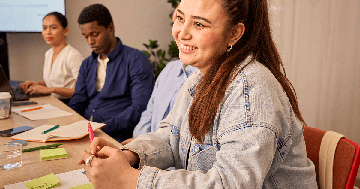 A man and a woman working in front of a laptop
