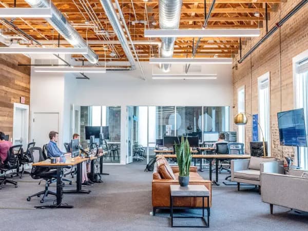 Office space with desks and sofas