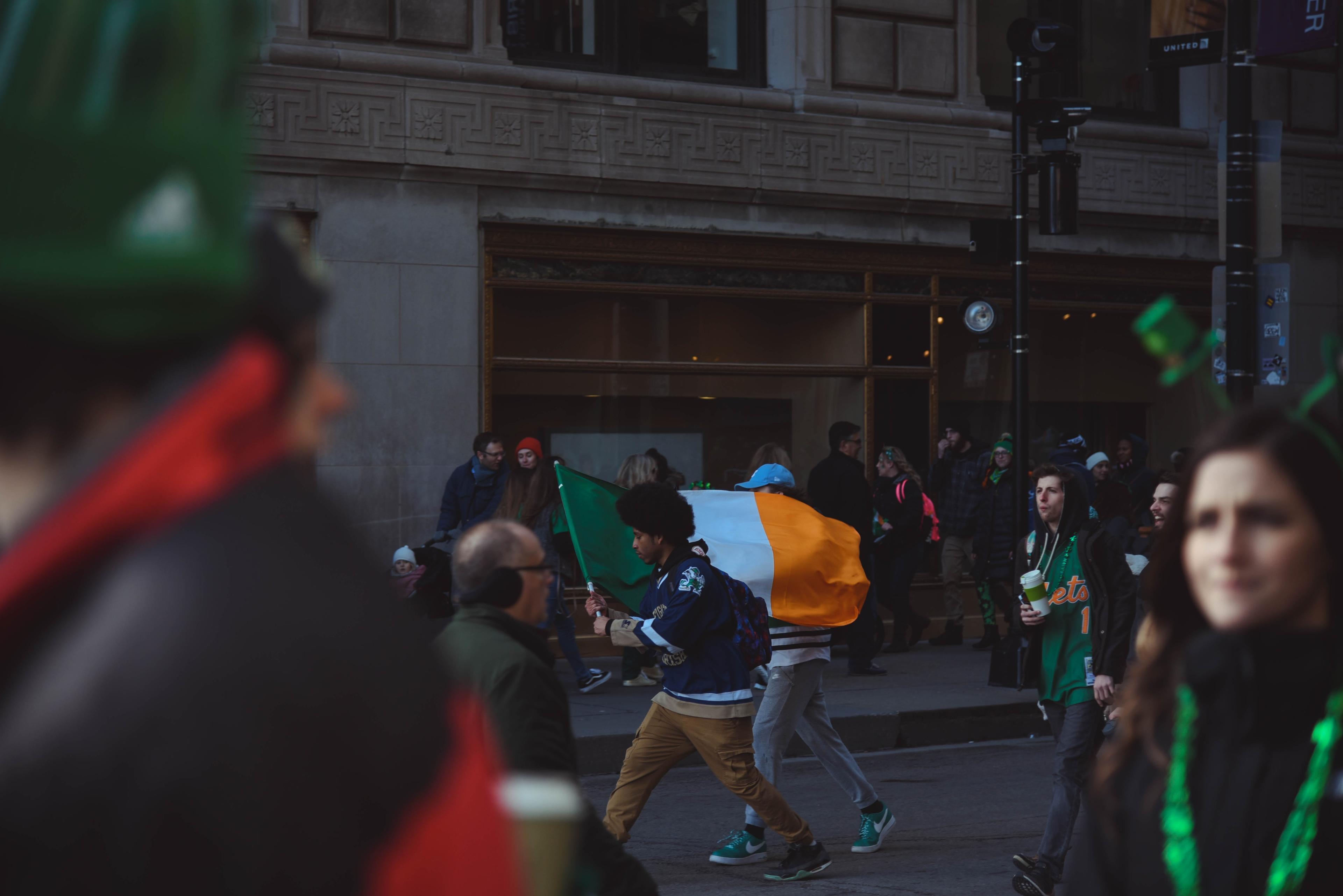 St.Patrick's Day, walking with Irish flag