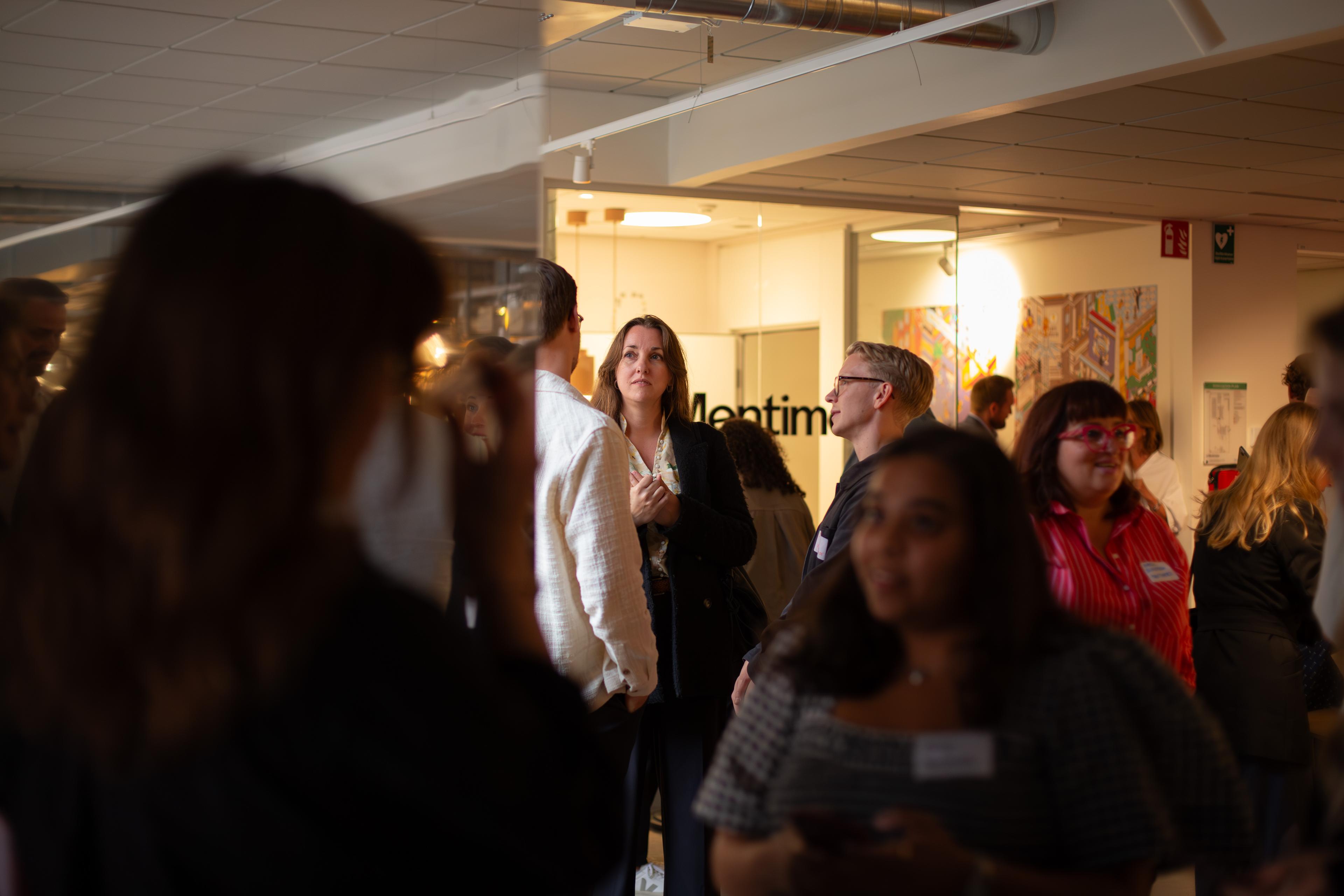 People meeting at a Mentimeter event