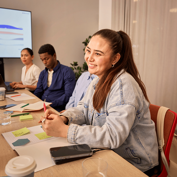 A man and a woman working in front of a laptop